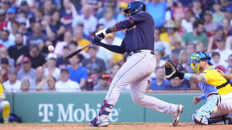 Jul 25, 2022; Boston, Massachusetts, USA; Cleveland Guardians designated hitter Franmil Reyes (32) hits a single against the Boston Red Sox during the second inning at Fenway Park. Mandatory Credit: Gregory Fisher-USA TODAY Sports