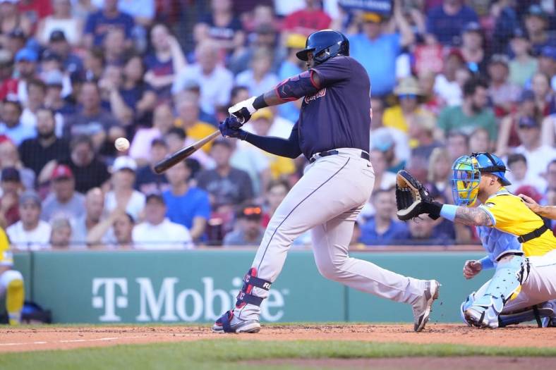 Jul 25, 2022; Boston, Massachusetts, USA; Cleveland Guardians designated hitter Franmil Reyes (32) hits a single against the Boston Red Sox during the second inning at Fenway Park. Mandatory Credit: Gregory Fisher-USA TODAY Sports