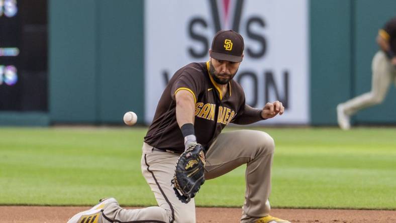 Jul 25, 2022; Detroit, Michigan, USA; San Diego Padres first baseman Eric Hosmer (30) makes a fielding error during the third inning on a ground ball from Detroit Tigers first baseman Harold Castro (30) at Comerica Park. Mandatory Credit: Raj Mehta-USA TODAY Sports