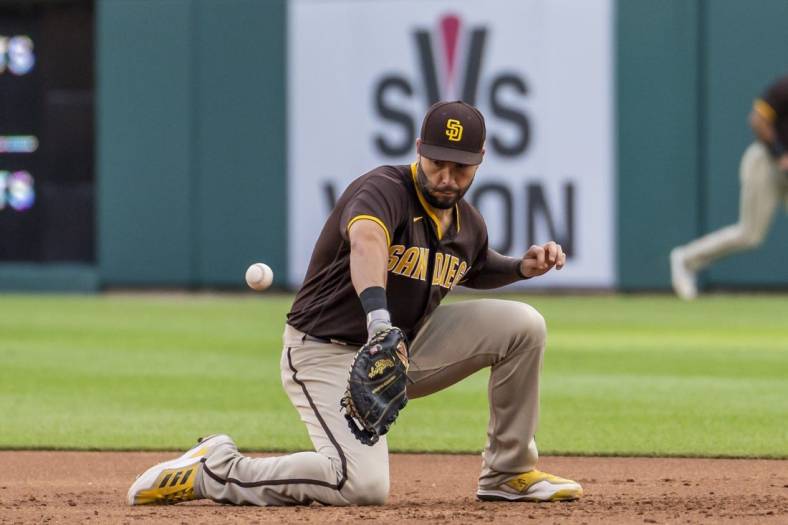 Jul 25, 2022; Detroit, Michigan, USA; San Diego Padres first baseman Eric Hosmer (30) makes a fielding error during the third inning on a ground ball from Detroit Tigers first baseman Harold Castro (30) at Comerica Park. Mandatory Credit: Raj Mehta-USA TODAY Sports
