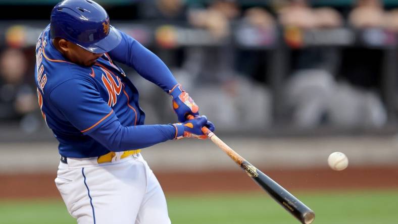 Jul 26, 2022; New York City, New York, USA; New York Mets third baseman Eduardo Escobar (10) hits a two run home run against the New York Yankees during the first inning at Citi Field. Mandatory Credit: Brad Penner-USA TODAY Sports