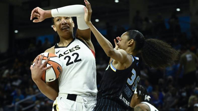 Jul 26, 2022; Chicago, IL, USA;  Las Vegas Aces forward A'ja Wilson (22), left, fights for the ball against Chicago Sky guard Rebekah Gardner (35) during the first half of the Commissioners Cup-Championships at Wintrust Arena. Mandatory Credit: Matt Marton-USA TODAY Sports