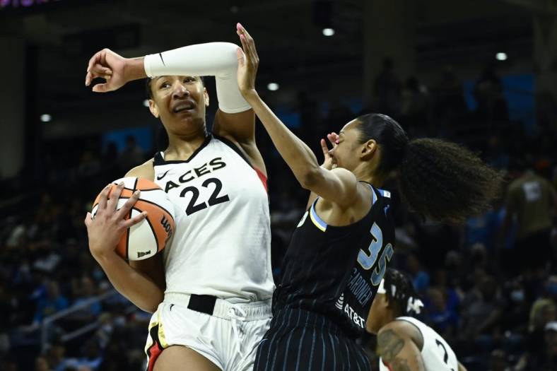 Jul 26, 2022; Chicago, IL, USA;  Las Vegas Aces forward A'ja Wilson (22), left, fights for the ball against Chicago Sky guard Rebekah Gardner (35) during the first half of the Commissioners Cup-Championships at Wintrust Arena. Mandatory Credit: Matt Marton-USA TODAY Sports