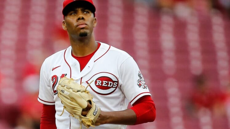 Cincinnati Reds starting pitcher Hunter Greene (21) resets between pitches in the fourth inning of the MLB National League game between the Cincinnati Reds and the Miami Marlins at Great American Ball Park in downtown Cincinnati on Tuesday, July 26, 2022.Miami Marlins At Cincinnati Reds