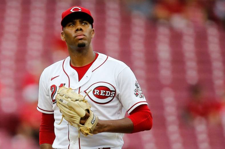 Cincinnati Reds starting pitcher Hunter Greene (21) resets between pitches in the fourth inning of the MLB National League game between the Cincinnati Reds and the Miami Marlins at Great American Ball Park in downtown Cincinnati on Tuesday, July 26, 2022.

Miami Marlins At Cincinnati Reds