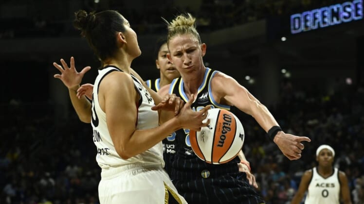 Jul 26, 2022; Chicago, IL, USA;  Chicago Sky forward Candace Parker (3), back and Chicago Sky guard Courtney Vandersloot (22) fight for the ball against Las Vegas Aces guard Kelsey Plum (10) during the second half of the Commissioners Cup-Championships at Wintrust Arena. Mandatory Credit: Matt Marton-USA TODAY Sports