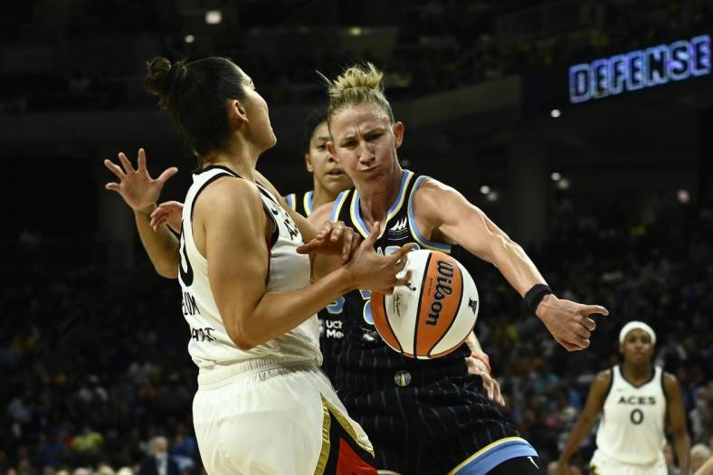 Jul 26, 2022; Chicago, IL, USA;  Chicago Sky forward Candace Parker (3), back and Chicago Sky guard Courtney Vandersloot (22) fight for the ball against Las Vegas Aces guard Kelsey Plum (10) during the second half of the Commissioners Cup-Championships at Wintrust Arena. Mandatory Credit: Matt Marton-USA TODAY Sports