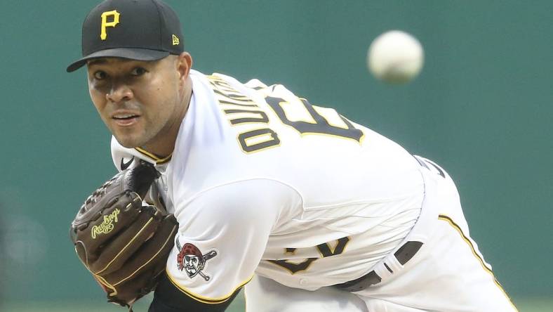 Jul 23, 2022; Pittsburgh, Pennsylvania, USA; Pittsburgh Pirates starting pitcher Jose Quintana (62) throws a warm-up pitch against the Miami Marlins during the first inning at PNC Park. Mandatory Credit: Charles LeClaire-USA TODAY Sports