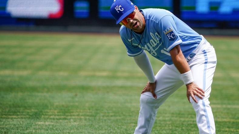 Jul 24, 2022; Kansas City, Missouri, USA; Kansas City Royals second baseman Whit Merrifield (15) stretches prior to the game against the Tampa Bay Rays at Kauffman Stadium. Mandatory Credit: Denny Medley-USA TODAY Sports