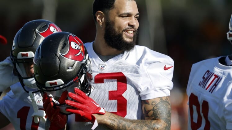 Jul 27, 2022; Tampa, FL, USA;  Tampa Bay Buccaneers wide receiver Mike Evans (13) smiles at Advent Health Training Complex. Mandatory Credit: Kim Klement-USA TODAY Sports