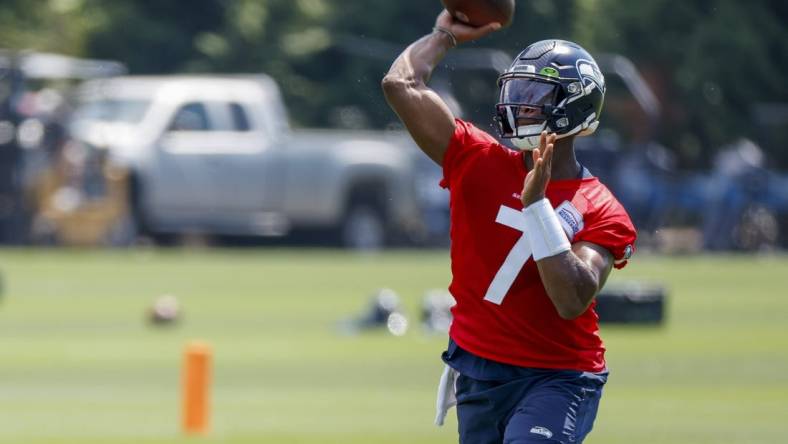 Jul 27, 2022; Renton, WA, USA; Seattle Seahawks quarterback Geno Smith (7) passes during training camp practice at Virginia Mason Athletic Center. Mandatory Credit: Joe Nicholson-USA TODAY Sports