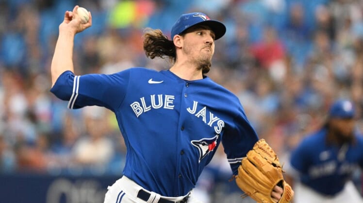 Jul 27, 2022; Toronto, Ontario, CAN; Toronto Blue Jays starting pitcher Kevin Gausman (34) delivers a pitch against the St. Louis Cardinals in the first inning at Rogers Centre. Mandatory Credit: Dan Hamilton-USA TODAY Sports