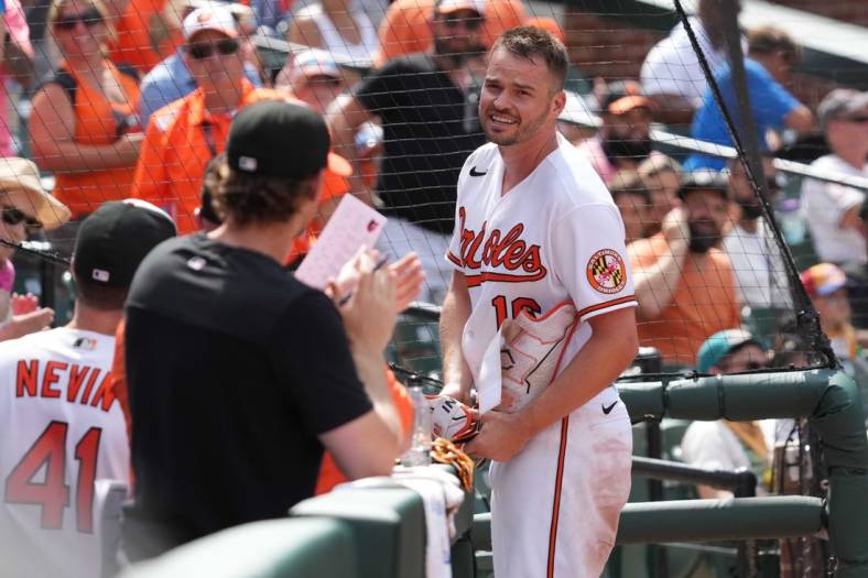 Jul 28, 2022; Baltimore, Maryland, USA; Baltimore Orioles designated hitter Trey Mancini (16) takes a curtain call following his two-run, inside-the-park home run in the eighth inning against the Tampa Bay Rays at Oriole Park at Camden Yards. Mandatory Credit: Mitch Stringer-USA TODAY Sports