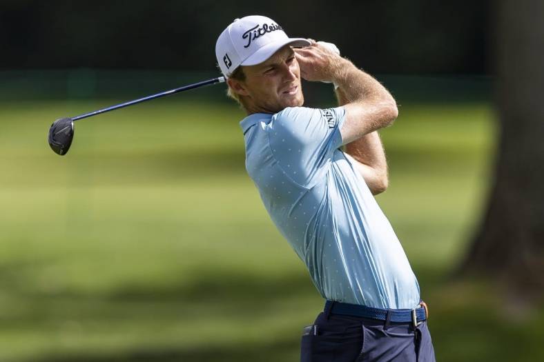 Jul 28, 2022; Detroit, Michigan, USA; Will Zalatoris hits his second shot on the par 5 fourteenth hole during the first round of the Rocket Mortgage Classic golf tournament. Mandatory Credit: Raj Mehta-USA TODAY Sports