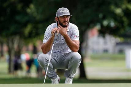Max Homa aims for the 13th hole during Round 1 of the Rocket Mortgage Classic at the Detroit Golf Club in Detroit on Thursday, July 28, 2022.