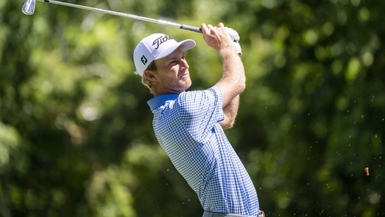 Jul 29, 2022; Detroit, Michigan, USA; Will Zalatoris tees off on the par 3 ninth hole during the second round of the Rocket Mortgage Classic golf tournament. Mandatory Credit: Raj Mehta-USA TODAY Sports