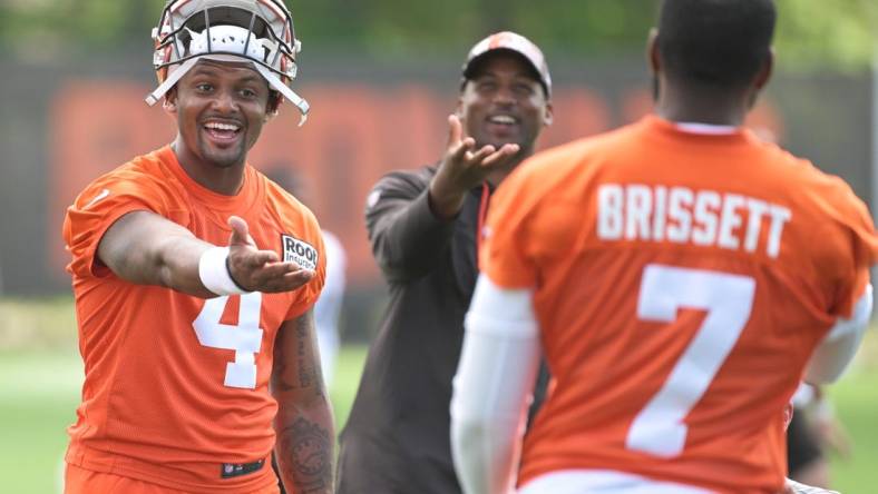 Jul 29, 2022; Berea, OH, USA; Cleveland Browns quarterback Deshaun Watson (4) talks to quarterback Jacoby Brissett (7) during training camp at CrossCountry Mortgage Campus. Mandatory Credit: Ken Blaze-USA TODAY Sports