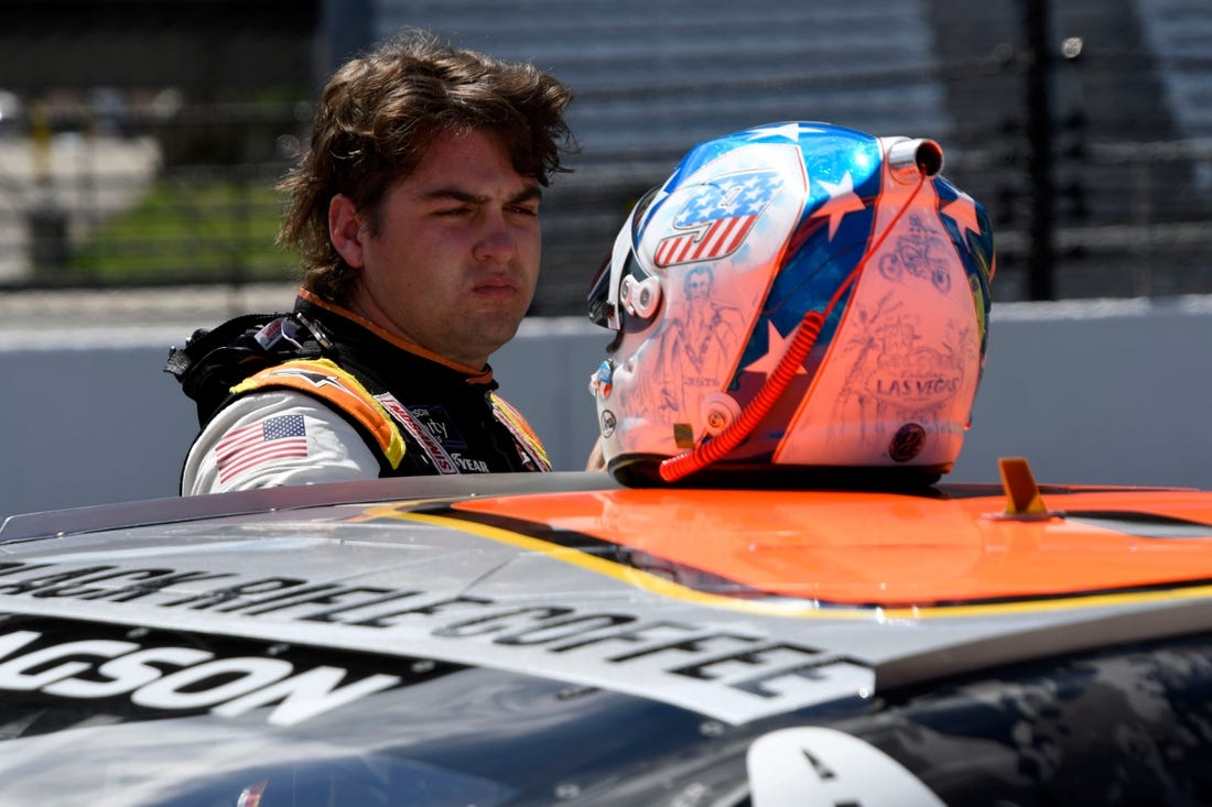 NASCAR Xfinity Series driver Noah Gragson (9) stands by his car Friday, July 29, 2022, during qualifying for the Pennzoil 150 at the Brickyard at Indianapolis Motor Speedway.