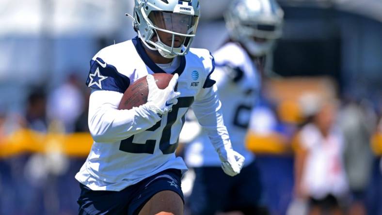 Jul 29, 2022; Onxard, CA, USA;   Dallas Cowboys running back Tony Pollard (20) carries the ball during training camp at River Ridge Fields in Oxnard, CA. Mandatory Credit: Jayne Kamin-Oncea-USA TODAY Sports