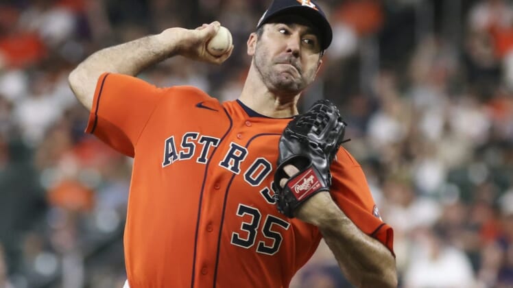 Jul 29, 2022; Houston, Texas, USA; Houston Astros starting pitcher Justin Verlander (35) pitches against the Seattle Mariners in the second inning at Minute Maid Park. Mandatory Credit: Thomas Shea-USA TODAY Sports