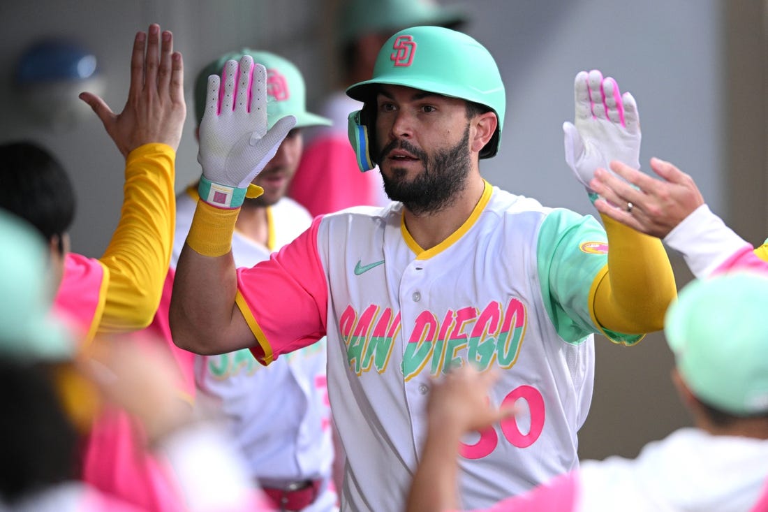 Jul 29, 2022; San Diego, California, USA; San Diego Padres first baseman Eric Hosmer (30) is congratulated in the dugout after hitting a home run against the Minnesota Twins during the fourth inning at Petco Park. Mandatory Credit: Orlando Ramirez-USA TODAY Sports