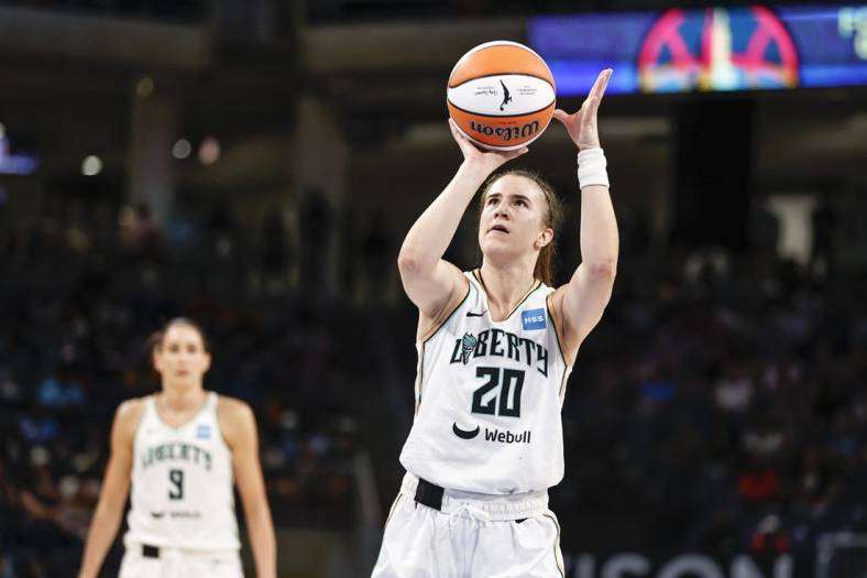Jul 29, 2022; Chicago, Illinois, USA; New York Liberty guard Sabrina Ionescu (20) shoots a free throw against the Chicago Sky during the second half of the WNBA game at Wintrust Arena. Mandatory Credit: Kamil Krzaczynski-USA TODAY Sports