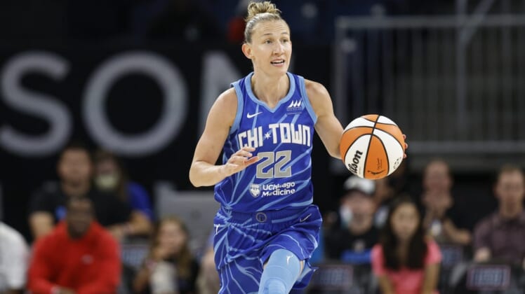 Jul 29, 2022; Chicago, Illinois, USA; Chicago Sky guard Courtney Vandersloot (22) brings the ball up court during the first half of the WNBA game against the New York Liberty at Wintrust Arena. Mandatory Credit: Kamil Krzaczynski-USA TODAY Sports