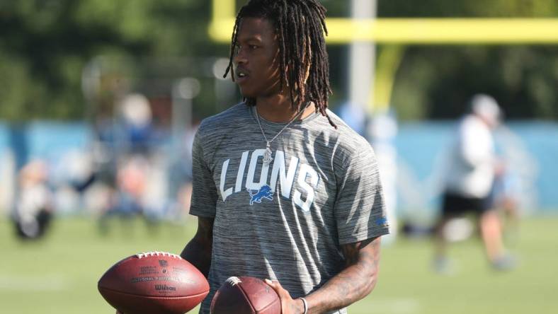 Detroit Lions receiver Jameson Williams watches passing drills during practice Thursday, July 28, 2022 at the Allen Park practice facility.Lions1