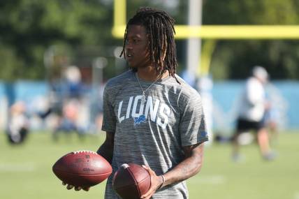 Detroit Lions receiver Jameson Williams watches passing drills during practice Thursday, July 28, 2022 at the Allen Park practice facility.Lions1
