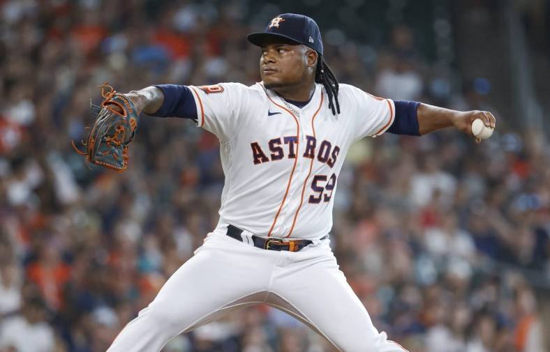 Jul 30, 2022; Houston, Texas, USA; Houston Astros starting pitcher Framber Valdez (59) delivers a pitch during the first inning against the Seattle Mariners at Minute Maid Park. Mandatory Credit: Troy Taormina-USA TODAY Sports