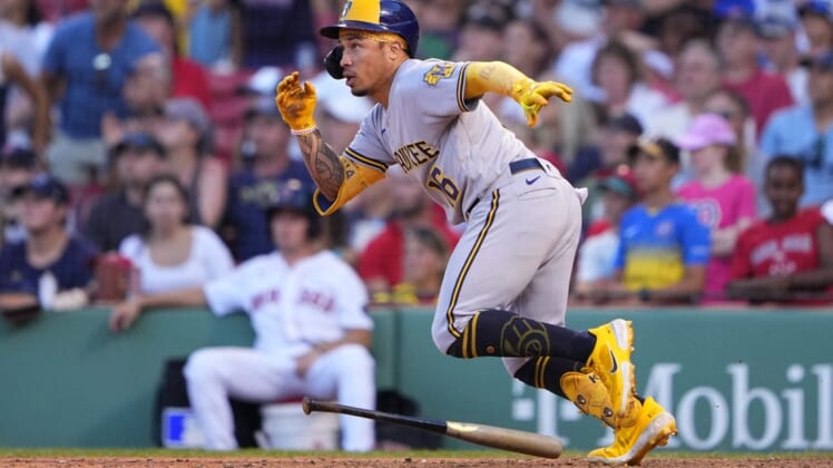 Jul 30, 2022; Boston, Massachusetts, USA; Milwaukee Brewers second baseman Kolten Wong (16) runs out a double against the Boston Red Sox during the ninth inning at Fenway Park. Mandatory Credit: Gregory Fisher-USA TODAY Sports