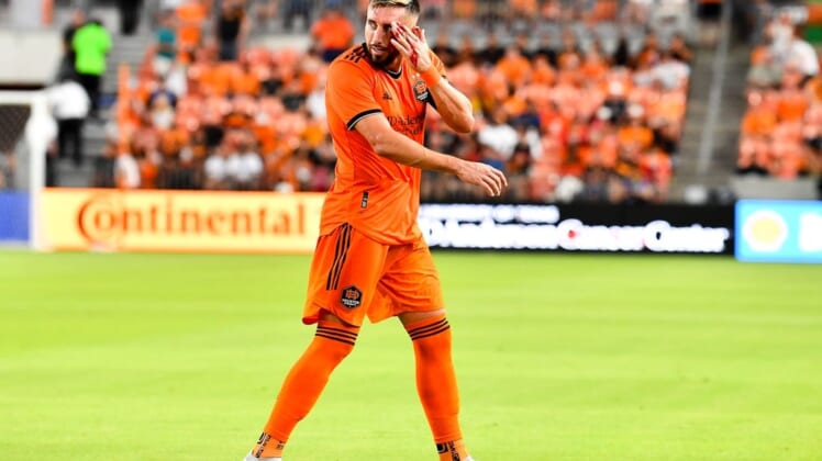 Jul 23, 2022; Houston, Texas, USA;  Houston Dynamo FC midfielder Hector Herrera (16) motions to the sideline as he bleeds from a header during the first half against the Minnesota United FC at PNC Stadium. Mandatory Credit: Maria Lysaker-Houston Dynamo FC-USA TODAY Sports