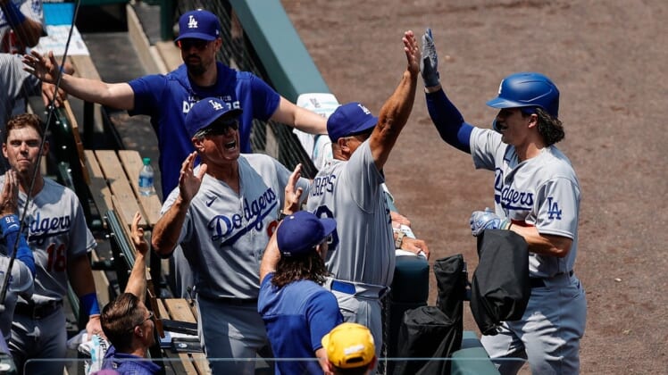 Jul 31, 2022; Denver, Colorado, USA; Los Angeles Dodgers right fielder James Outman (77) celebrates with manager Dave Roberts (30) and bench coach Bob Geren (88) after hitting a home run on his first career at bat in the first inning against the Colorado Rockies at Coors Field. Mandatory Credit: Isaiah J. Downing-USA TODAY Sports