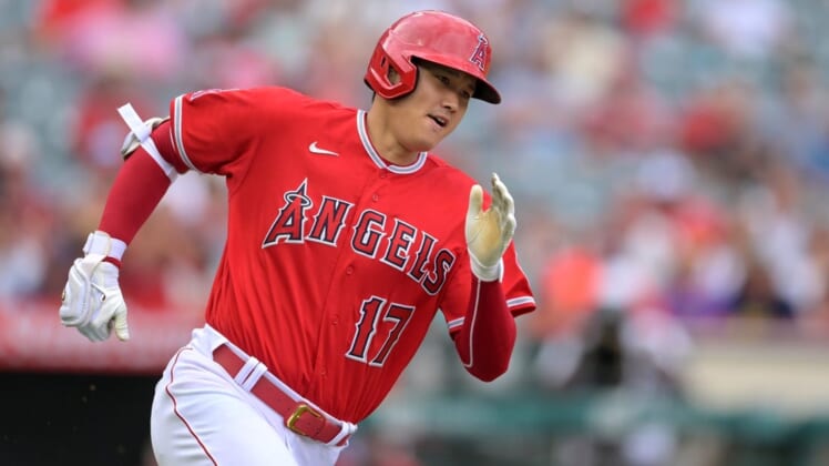 Jul 31, 2022; Anaheim, California, USA; Los Angeles Angels designated hitter Shohei Ohtani (17) rounds the bases on a triple in the first inning against the Texas Rangers at Angel Stadium. Mandatory Credit: Jayne Kamin-Oncea-USA TODAY Sports