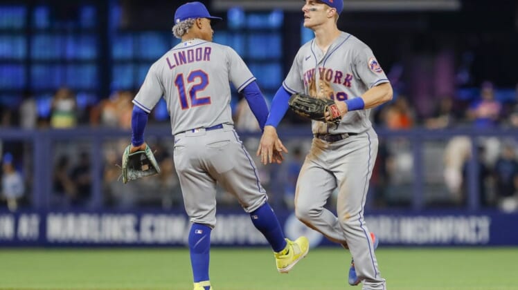 Jul 31, 2022; Miami, Florida, USA; New York Mets shortstop Francisco Lindor (12) celebrates with left fielder Mark Canha (19) after winning the game against the Miami Marlins at loanDepot Park. Mandatory Credit: Sam Navarro-USA TODAY Sports