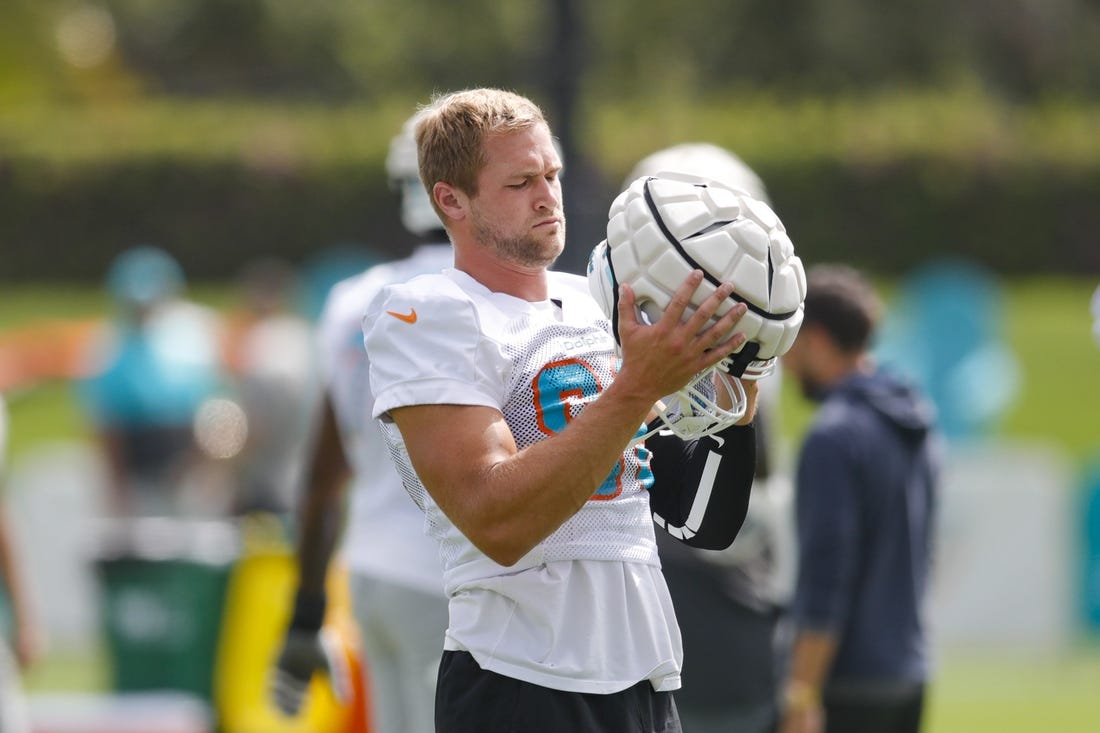 Aug 1, 2022; Miami Gardens, Florida, US; Miami Dolphins tight end Mike Gesicki (88) puts his helmet on during training camp at Baptist Health Training Complex. Mandatory Credit: Sam Navarro-USA TODAY Sports