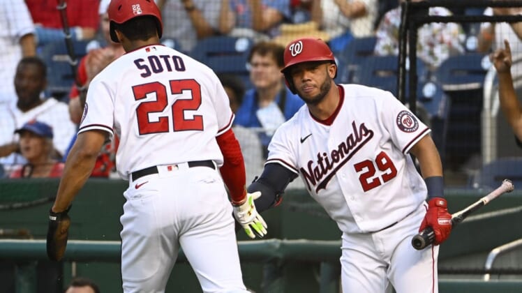 Aug 1, 2022; Washington, District of Columbia, USA; Washington Nationals right fielder Juan Soto (22) is congratulated by left fielder Yadiel Hernandez (29) after scoring a run against the New York Mets during the first inning at Nationals Park. Mandatory Credit: Brad Mills-USA TODAY Sports