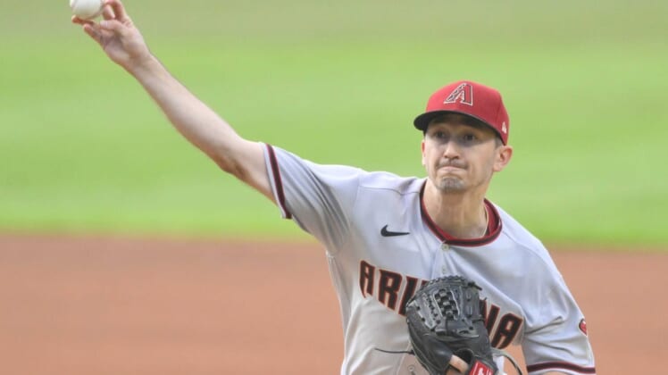 Aug 1, 2022;  Cleveland, Ohio, USA;  Arizona Diamondbacks starting pitcher Zach Davies (27) delivers a pitch in the first inning against the Cleveland Guardians at Progressive Field.  Mandatory Credit: David Richard-USA TODAY Sports
