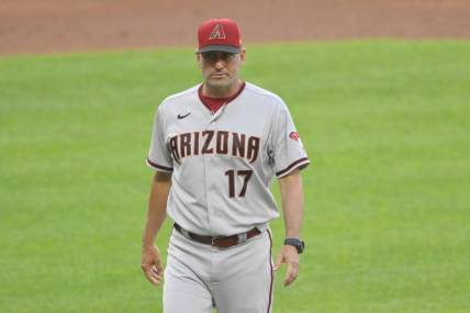 Aug 1, 2022; Cleveland, Ohio, USA; Arizona Diamondbacks manager Torey Lovullo (17) walks on the field during a pitching change in the third inning against the Cleveland Guardians at Progressive Field. Mandatory Credit: David Richard-USA TODAY Sports