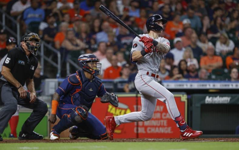 Aug 1, 2022; Houston, Texas, USA; Boston Red Sox center fielder Jarren Duran (40) hits an RBI double during the third inning against the Houston Astros at Minute Maid Park. Mandatory Credit: Troy Taormina-USA TODAY Sports