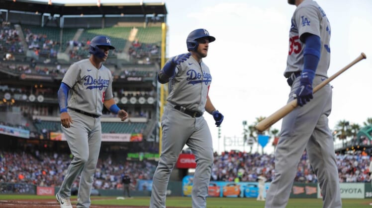 Aug 1, 2022; San Francisco, California, USA;  Los Angeles Dodgers third baseman Max Muncy (13) celebrates with center fielder Cody Bellinger (35) after hitting a two run home run during the second inning against the San Francisco Giants at Oracle Park. Mandatory Credit: Sergio Estrada-USA TODAY Sports