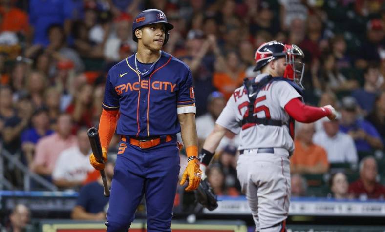 Aug 1, 2022; Houston, Texas, USA; Houston Astros shortstop Jeremy Pena (3) reacts after striking out during the eighth inning against the Boston Red Sox at Minute Maid Park. Mandatory Credit: Troy Taormina-USA TODAY Sports