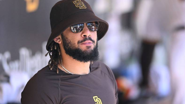 Aug 2, 2022; San Diego, California, USA; San Diego Padres shortstop Fernando Tatis Jr. (23) looks on from the dugout during the fourth inning against the Colorado Rockies at Petco Park. Mandatory Credit: Orlando Ramirez-USA TODAY Sports