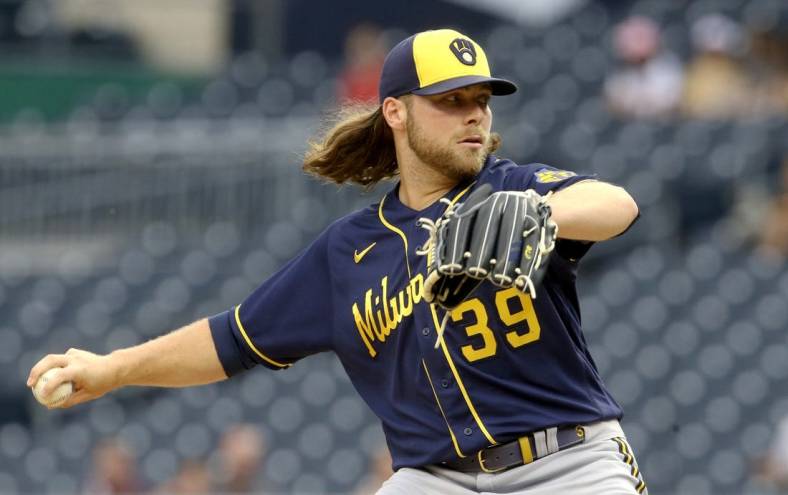 Aug 2, 2022; Pittsburgh, Pennsylvania, USA;  Milwaukee Brewers starting pitcher Corbin Burnes (39) delivers a pitch against the Pittsburgh Pirates during the first inning at PNC Park. Mandatory Credit: Charles LeClaire-USA TODAY Sports