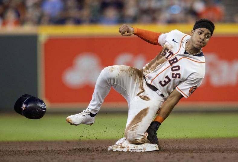 Aug 2, 2022; Houston, Texas, USA;  Houston Astros shortstop Jeremy Pena (3) is tagged out by Boston Red Sox second baseman Yolmer Sanchez (47) (not pictured) trying to steal second base in the second inning at Minute Maid Park. Mandatory Credit: Thomas Shea-USA TODAY Sports