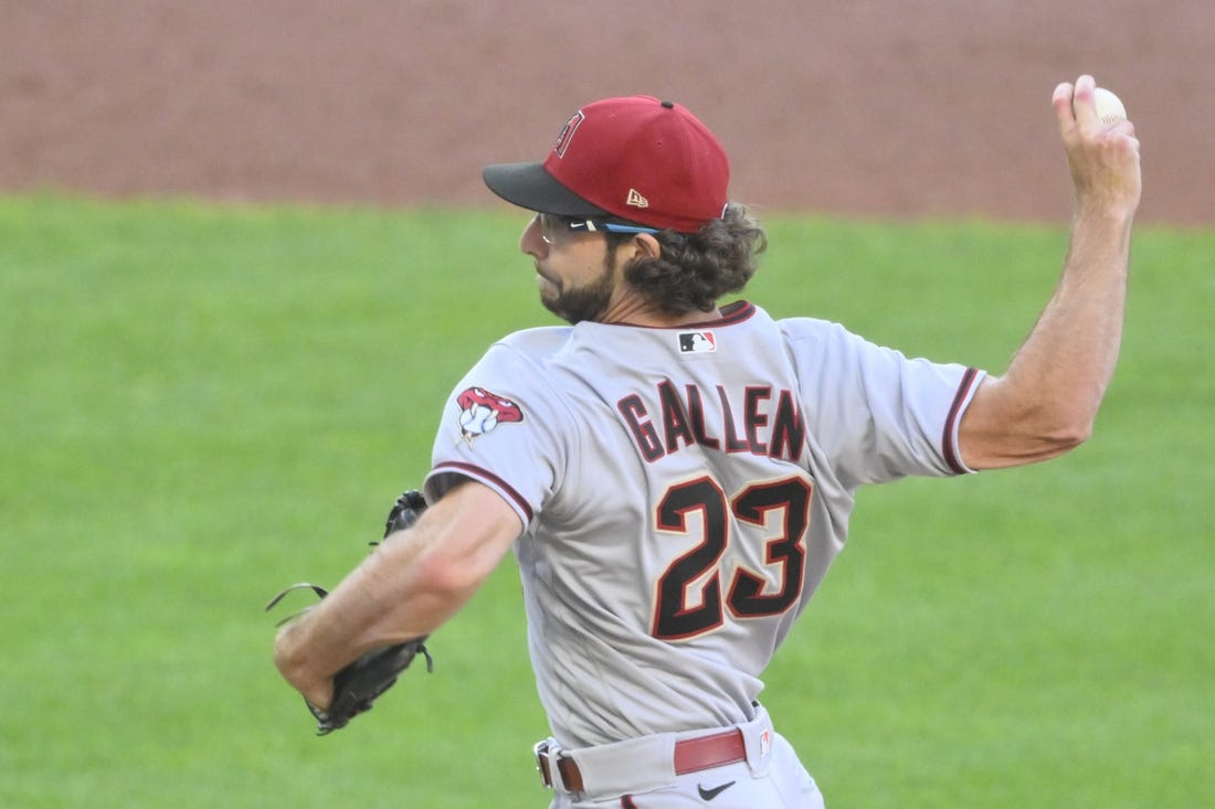 Aug 2, 2022; Cleveland, Ohio, USA; Arizona Diamondbacks starting pitcher Zac Gallen (23) delivers a pitch in the second inning against the Cleveland Guardians at Progressive Field. Mandatory Credit: David Richard-USA TODAY Sports