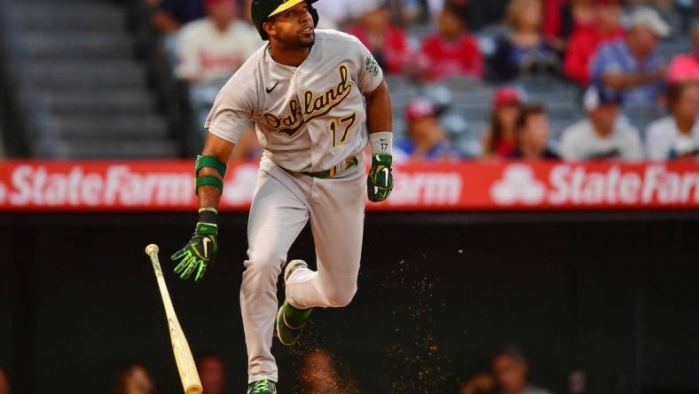 Aug 2, 2022; Anaheim, California, USA; Oakland Athletics shortstop Elvis Andrus (17) hits a single against the Los Angeles Angels during the fourth inning at Angel Stadium. Mandatory Credit: Gary A. Vasquez-USA TODAY Sports