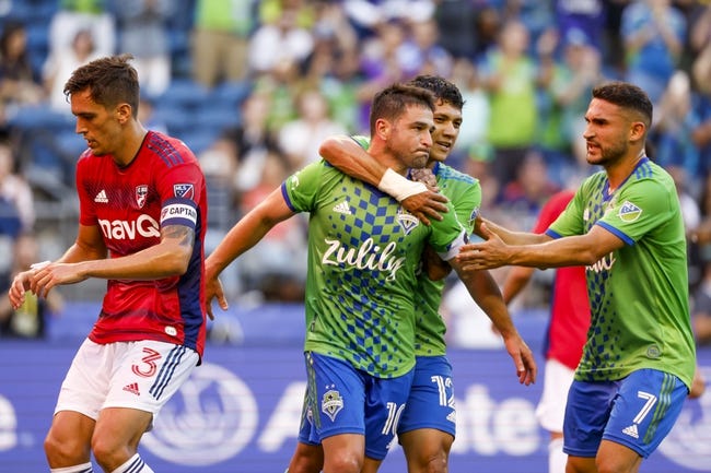 Aug 2, 2022; Seattle, Washington, USA; Seattle Sounders FC midfielder Nicolas Lodeiro (10) celebrates with forward Fredy Montero (12) and midfielder Cristian Roldan (7) after scoring a goal on a penalty kick against FC Dallas during the first half at Lumen Field. FC Dallas defender Jos   Antonio Martinez (3) retrieves the ball at left. Mandatory Credit: Joe Nicholson-USA TODAY Sports