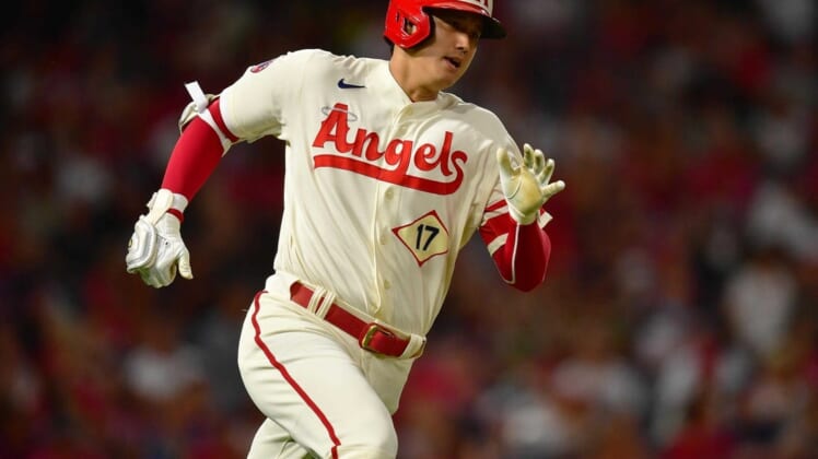 Aug 2, 2022; Anaheim, California, USA; Los Angeles Angels designated hitter Shohei Ohtani (17) runs after hitting a double against the Oakland Athletics during the fifth inning at Angel Stadium. Mandatory Credit: Gary A. Vasquez-USA TODAY Sports