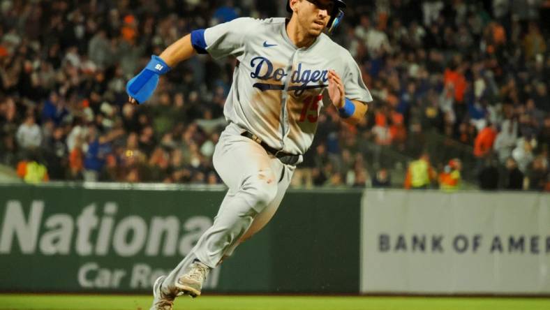 Aug 2, 2022; San Francisco, California, USA; Los Angeles Dodgers catcher Austin Barnes (15) rounds third base against the San Francisco Giants during the eighth inning at Oracle Park. Mandatory Credit: Kelley L Cox-USA TODAY Sports